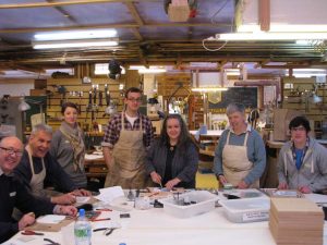 Furniture school students learning from Eilidh Keith, stained glasss artist